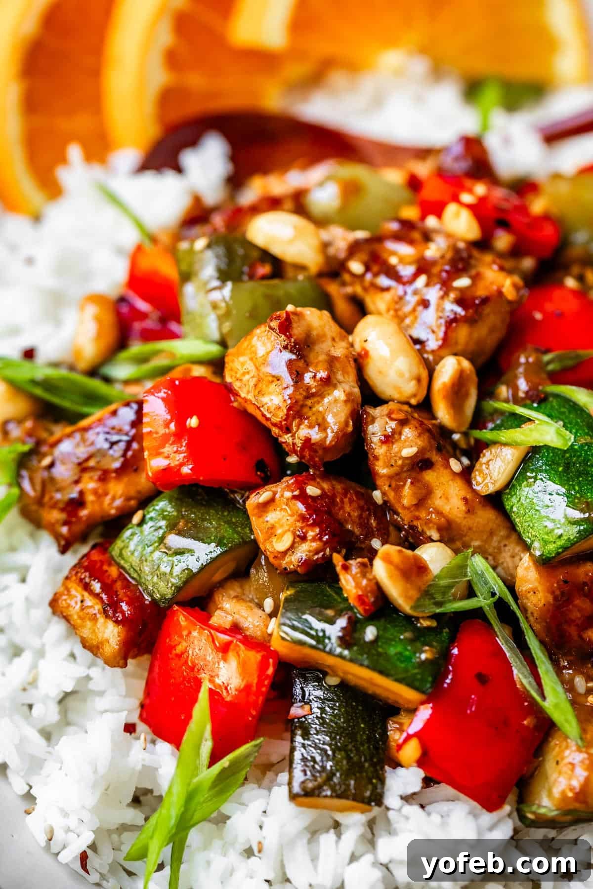 Szechuan Kung Pao Chicken 20 Kung Pao chicken with zucchini and bell peppers and green onions on rice.