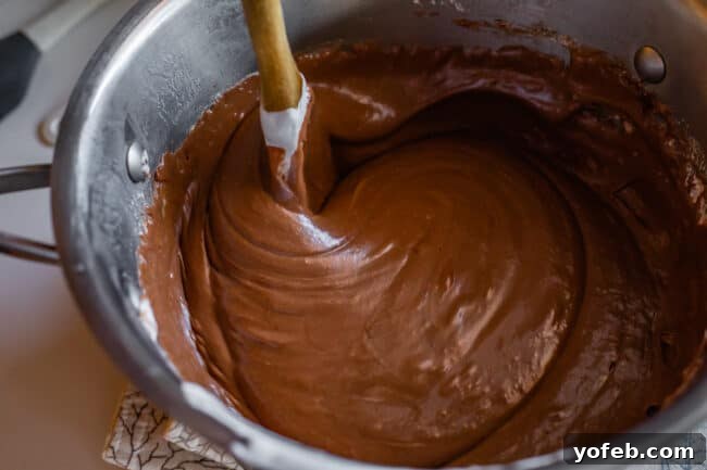Mom's Effortless Fudge 23 A pot of impeccably smooth and creamy fudge, perfectly mixed and ready to be poured into its prepared pan.