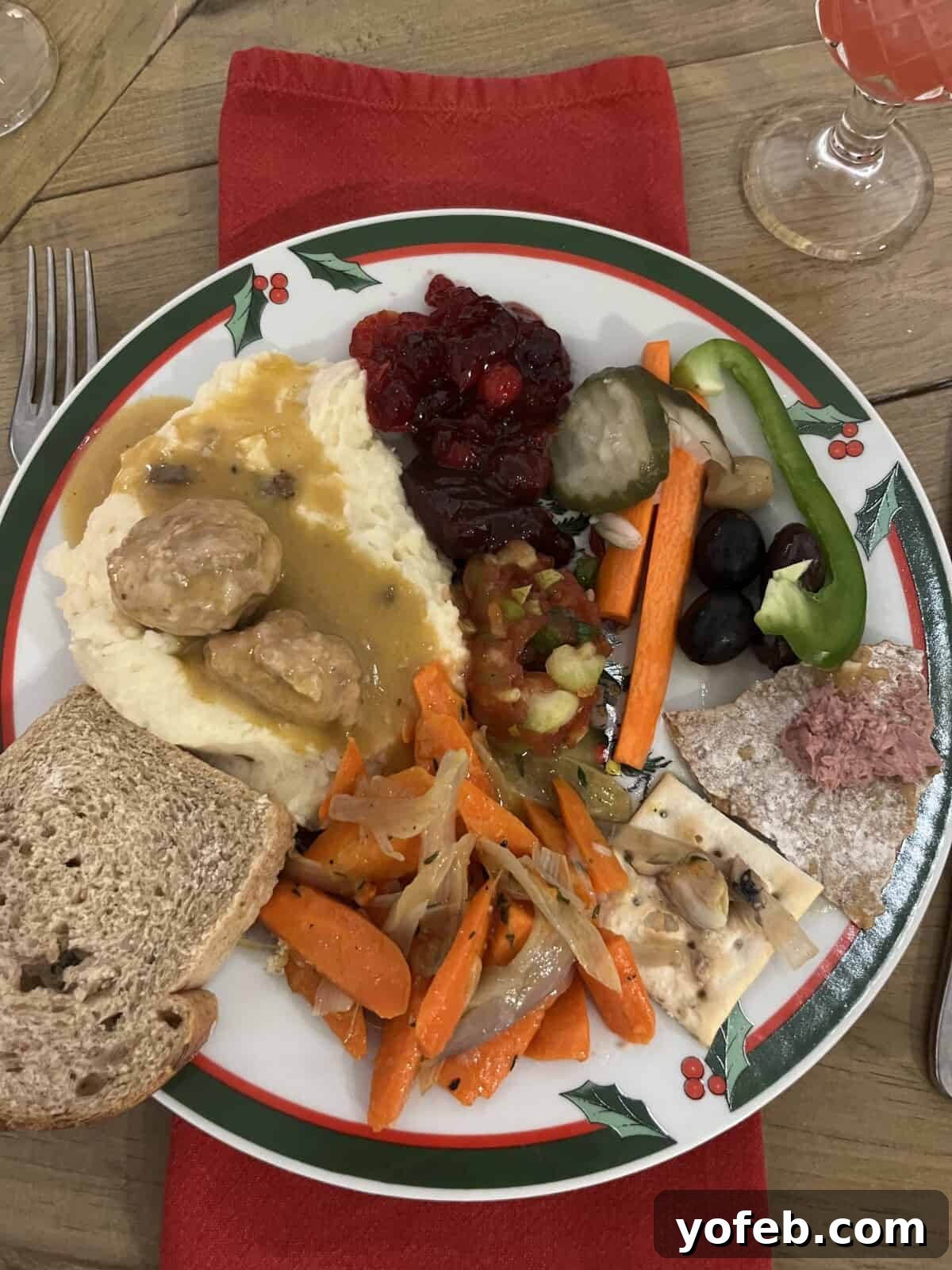 Grandma Prudy's Timeless Swedish Meatballs 4 An overhead shot of a plate laden with traditional Swedish Christmas Eve food, showcasing a variety of dishes.