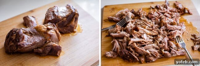 Slow Cooker Pork Ramen Deep Flavor Zero Fuss 19 cooked pork shoulder on a cutting board, shredded pork with 2 forks