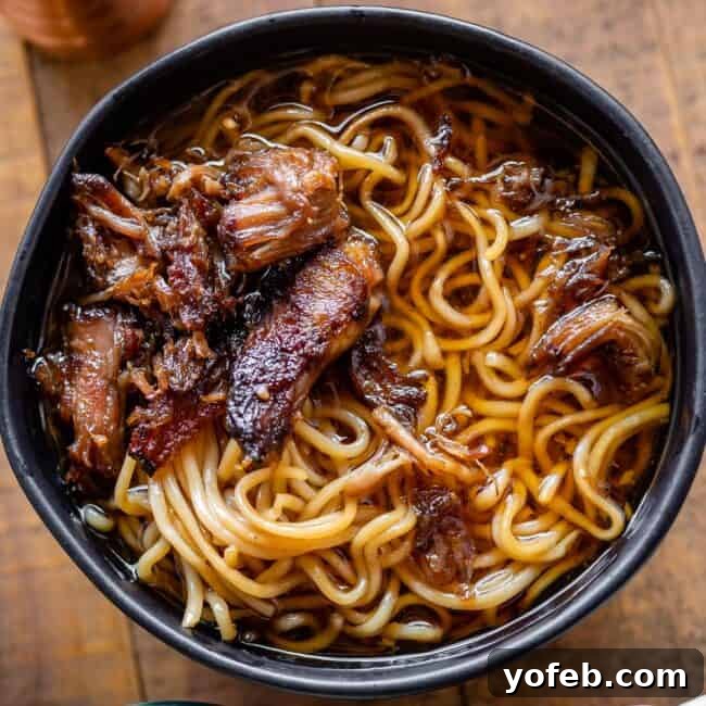 Slow Cooker Pork Ramen Deep Flavor Zero Fuss 21 simple black bowl of ramen with crispy pork and no garnishes
