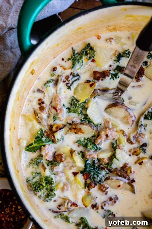 Zuppa Toscana Copycat in a Teal Pot Zuppa Toscana simmering in a vibrant teal pot, ready to be served.
