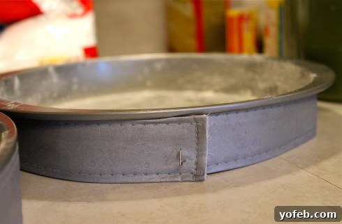 How to Make an Elmo Cake The Easy Way No Cake Pan Required 3 Bake-Even Cake Strips wrapped around a cake pan, ready for baking.