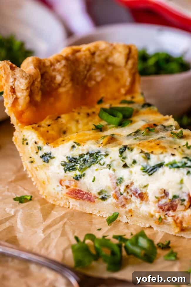 Effortless Bacon and Spinach Quiche 27 A delicious quiche recipe with spinach and bacon, expertly sliced and arranged on parchment paper, ready to be served.