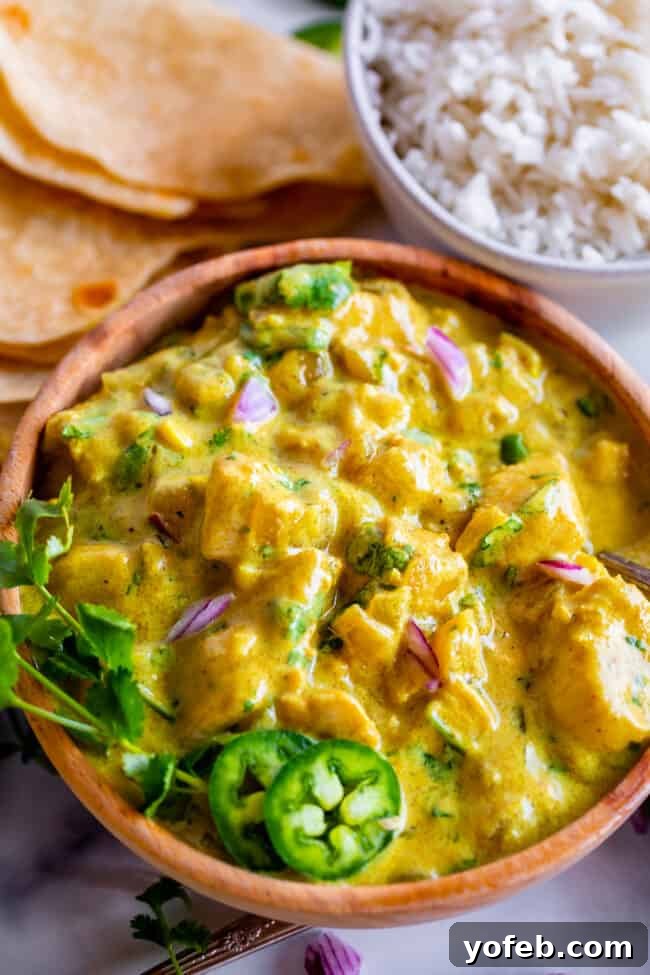 Flavorful Chicken Curry Made Easy 8 curry sauce with chicken and onion and jalapeno and cilantro.