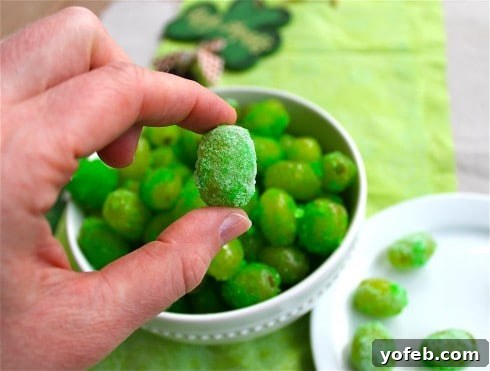 Emerald Zest Bites 4 Close-up of Sour Patch Grapes coated in green gelatin, ready to eat