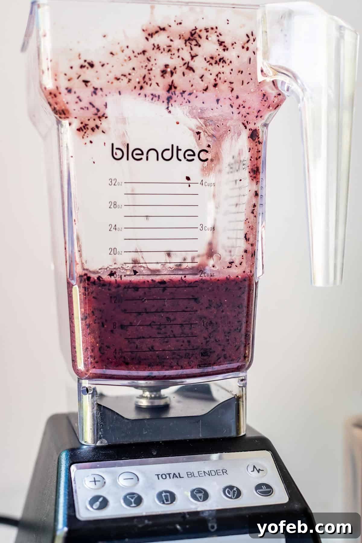 Grandma's Classic Blueberry Pie 14 A Blendtec blender containing pureed blueberries, demonstrating the liquid consistency needed for the pie filling base.