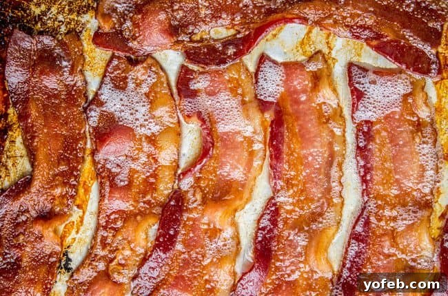 Zesty Lemon Bacon Pea Pasta 7 Perfectly crispy oven-baked bacon, golden brown and ready for chopping, a key ingredient for this pasta dish.