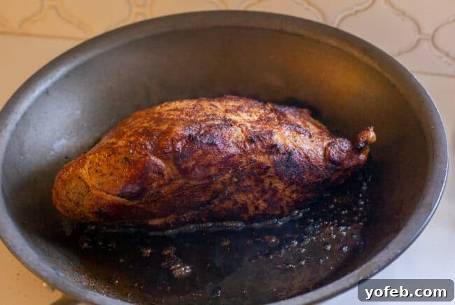 Melt In Your Mouth Pulled Pork Slow Cooker Or Oven 11 searing pork shoulder in a skillet.
