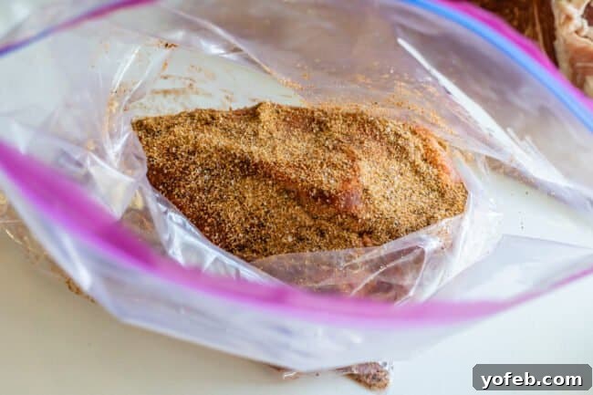 Smoky Perfection: The Ultimate Pulled Pork 11 spice rubbed pork should in a ziplock bag.