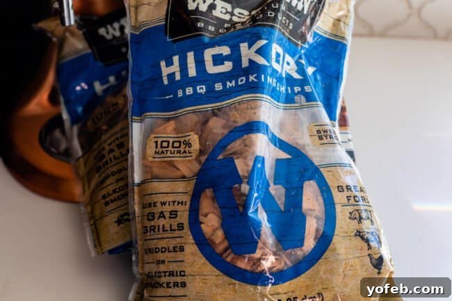 Smoky Perfection: The Ultimate Pulled Pork 12 two bags of hickory bbq smoking chips on a white counter.