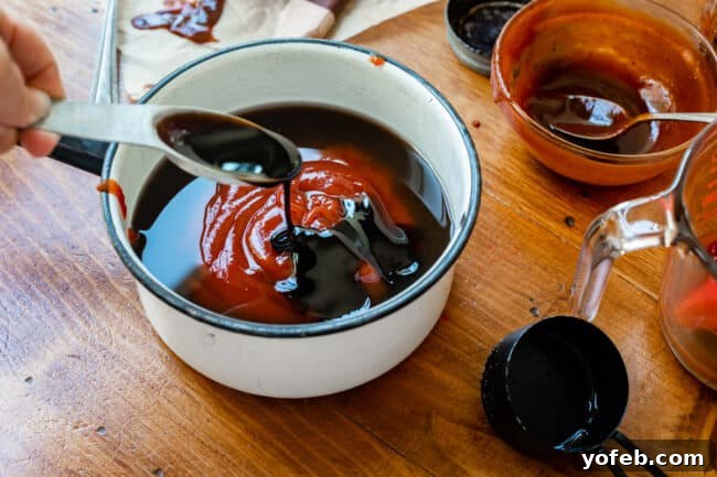 Effortless Homemade Barbecue 10 adding molasses to a white pot full of ketchup and other ingredients.