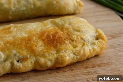 Golden Greek Chicken, Spinach & Feta Parcels 3 Inside view of a Greek Spinach Feta Chicken Pocket, showing the rich filling