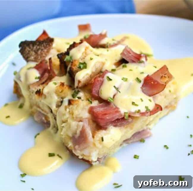 Brunch-Ready Overnight Eggs Benedict Bake 4 A vintage photograph from 2013 showing a slice of Eggs Benedict casserole with hollandaise sauce on a white plate, offering a nostalgic glimpse of the recipe's enduring appeal.
