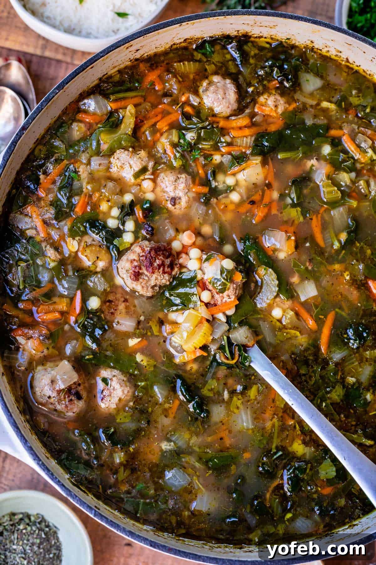 Mastering the Art of Italian Wedding Soup 5 stockpot filled with italian wedding soup recipe made of rich broth, vegetables, and tiny pasta and meatballs.