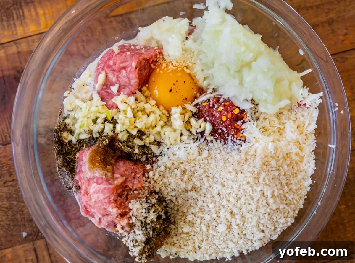 Mastering the Art of Italian Wedding Soup 10 glass bowl with meatball ingredients like ground meat, egg, and bread crumbs.