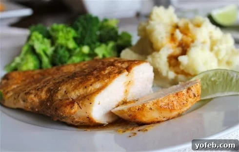 A dish of perfectly cooked garlic lime chicken with sauce