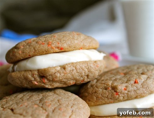 Carrot Cake Whoopie Pies with Tangy Cream Cheese Filling 3 Carrot Cake Cookie Sandwiches stacked with Cream Cheese Frosting