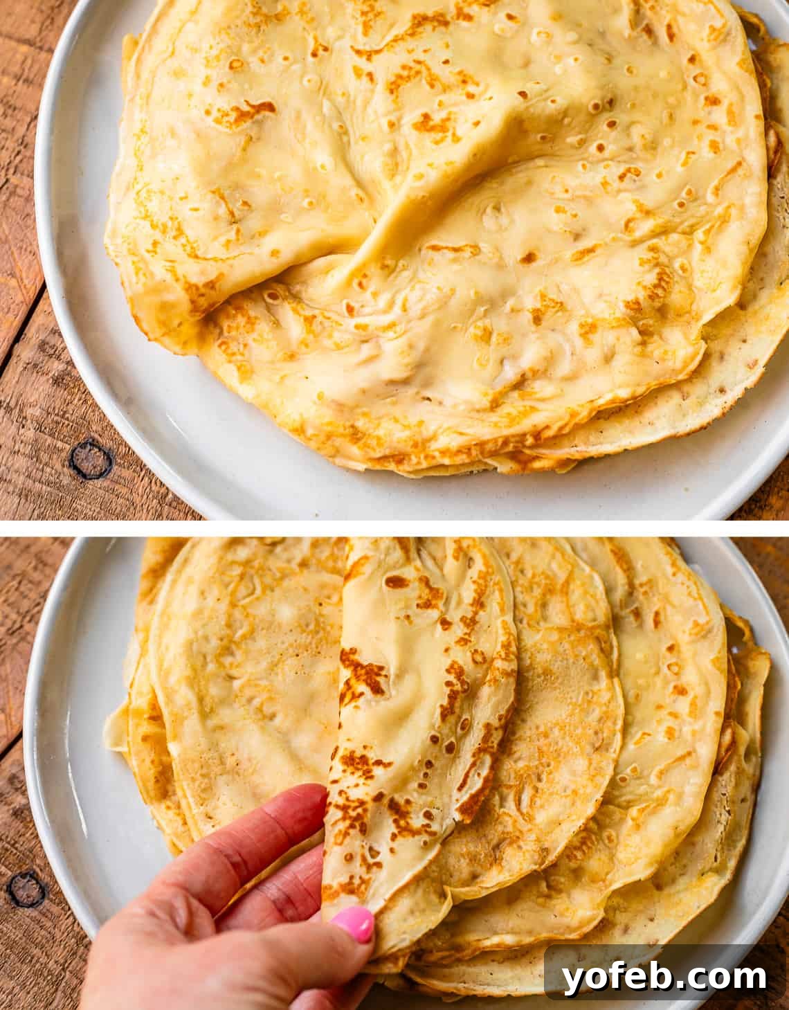 Absolutely The Best Crepes 21 A stack of golden crepes rests on a white plate, with a hand gently folding one of the delicate crepes over, highlighting its thin and pliable texture.