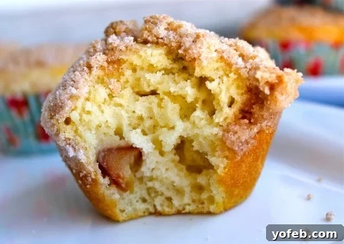 Tangy Rhubarb Cream Cheese Swirl Muffins 4 Cooked rhubarb mixture in a bowl, showing its soft texture and bright pink color, ready for use in a recipe.