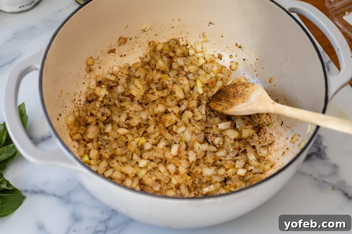 Effortless 30-Minute Spaghetti Sauce 9 Golden-brown chopped onions, perfectly sautéed with fragrant seasonings, ready for the next step in preparing an easy homemade spaghetti meat sauce.