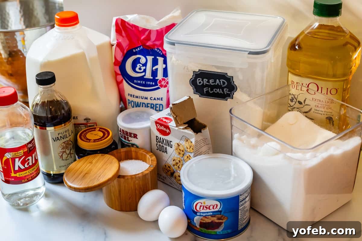 Doughnut Delights from Scratch 10 Ingredients for making homemade donuts laid out: flour, sugar, yeast, milk, eggs, shortening, and other essentials.