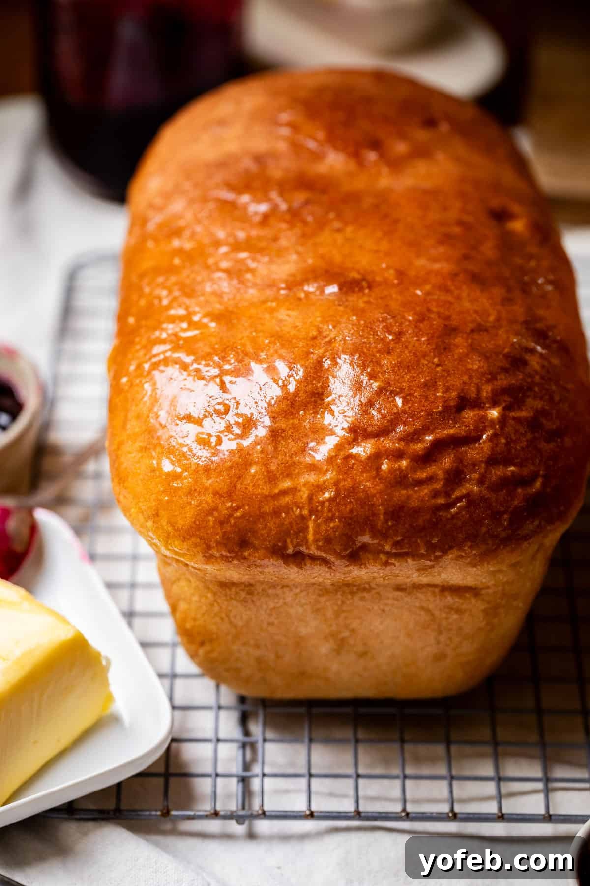 The White Bread Recipe That Ends Your Search 3 A perfectly baked, whole loaf of homemade white bread, cooling on a wire rack fresh from the oven.