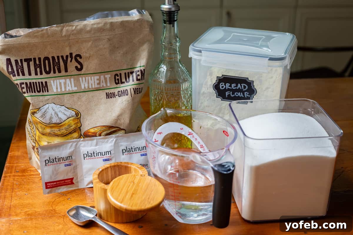 The White Bread Recipe That Ends Your Search 9 All the essential ingredients for homemade bread—flour, oil, sugar, water, yeast, and salt—neatly arranged on a rustic wooden table.