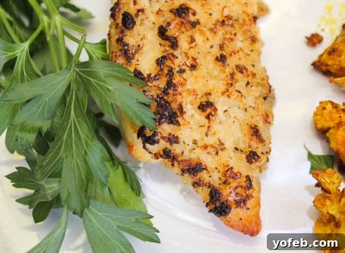 Golden Parmesan Baked Tilapia 3 A vibrant, fresh white painted built-in bookshelf, showcasing modern home interior design and DIY transformation.