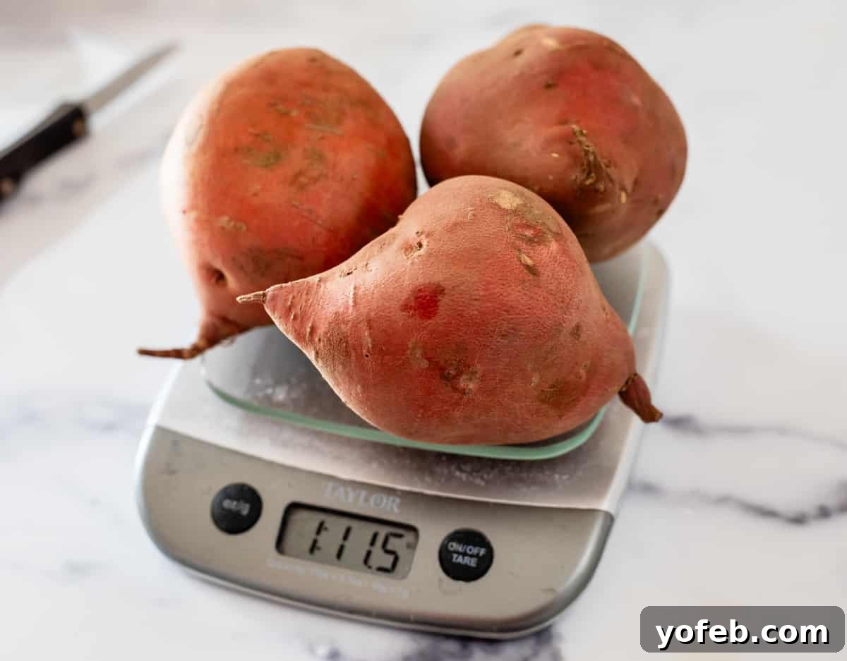 Golden Sweet Potato Pie Crowned with Salted Caramel Cream 9 three fat sweet potatoes sitting on a scale with the weight measuring 1 lb 11.5 oz.