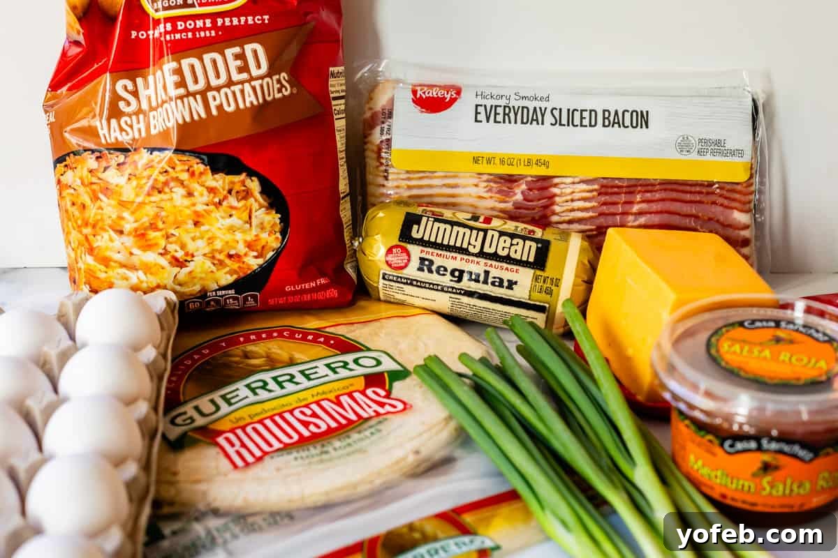 The Ultimate Make Ahead Breakfast Burrito Recipe 7 ingredients for breakfast burritos on a table.