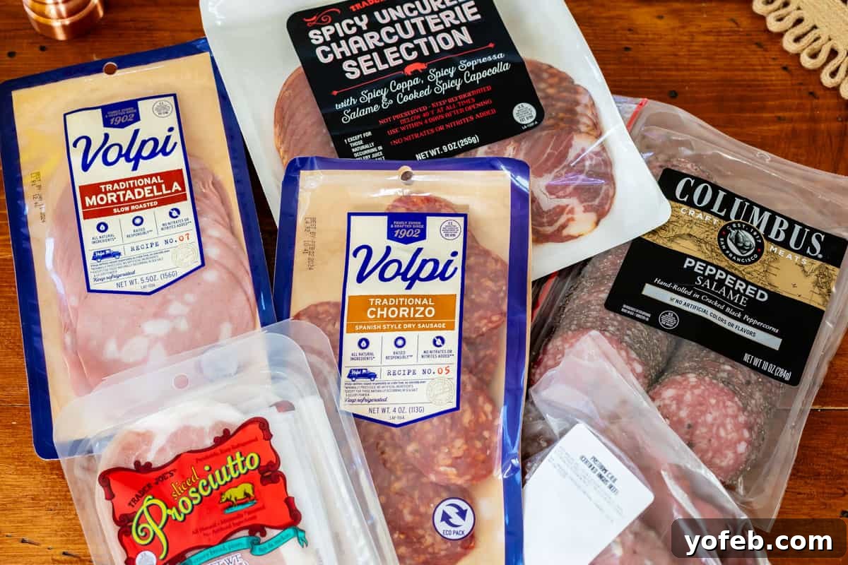 Crafting the Perfect Charcuterie Board 17 Assortment of packaged deli meats including mortadella, procsiutto, salame, chorizo, and roast beef.