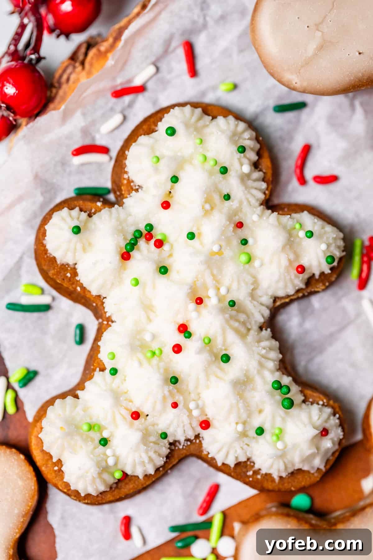 Perfectly Soft Chewy Gingerbread Men That Hold Their Shape 29 A beautifully decorated gingerbread cookie cut out, topped with buttercream frosting and festive sprinkles, ready to be enjoyed.