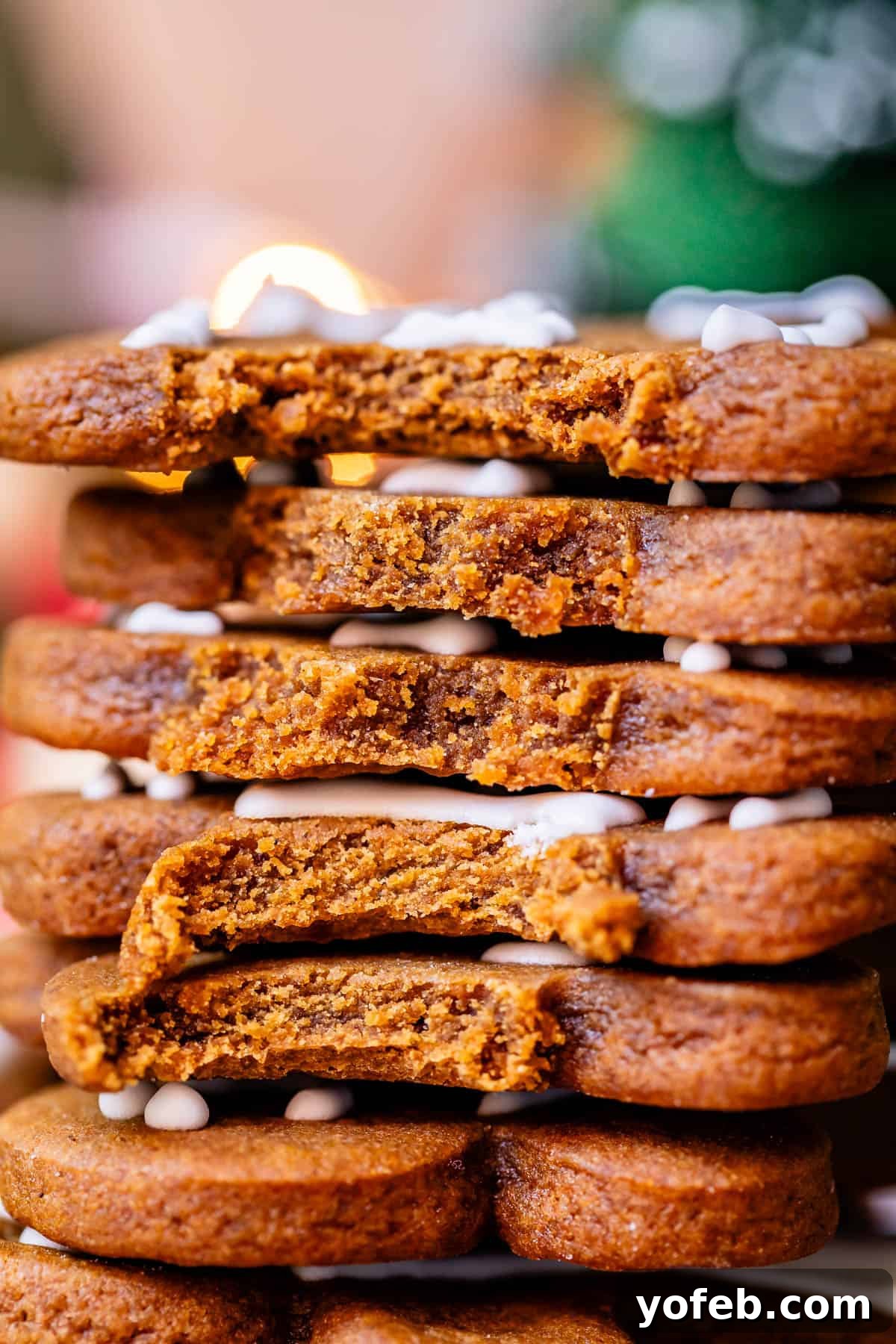 Perfectly Soft Chewy Gingerbread Men That Hold Their Shape 6 A stack of very soft and chewy gingerbread men cookies, some with bites taken out, demonstrating their irresistible texture.