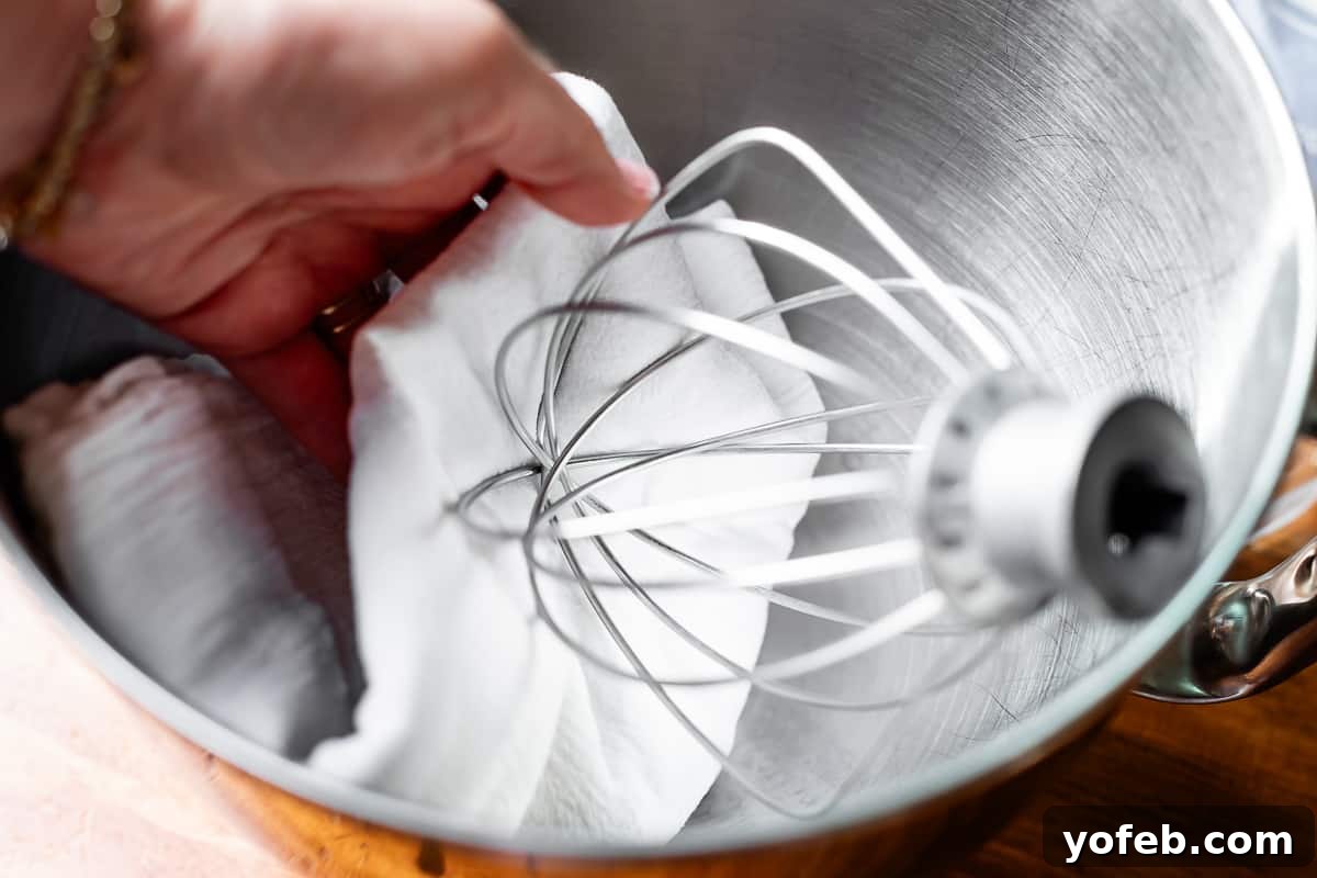 Beginner's Guide to Perfect Royal Icing 12 a tea towel dampened with vinegar wiping mixing bowl and whisk to remove all grease.