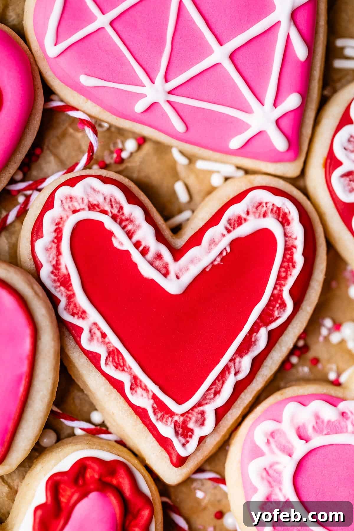 Beginner's Guide to Perfect Royal Icing 9 recipe for royal icing, shown on heart shaped sugar cookies.