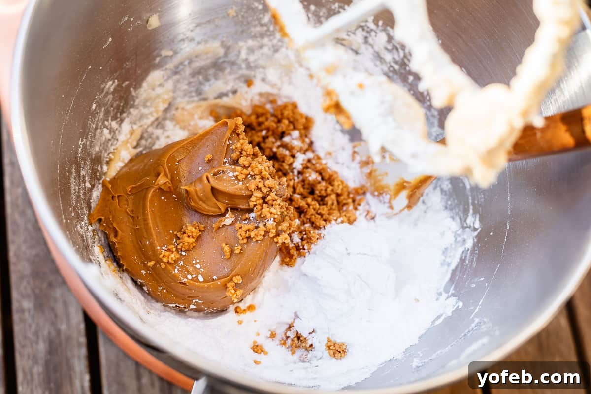 Irresistible Buckeye Ball Recipe 12 Peanut butter added into the mixing bowl with the other ingredients, ready to be mixed.