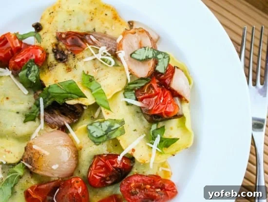 Sun-Kissed Tomato Basil Ravioli 8 Rustic Ravioli with Roasted Cherry Tomatoes and Basil on a Plate