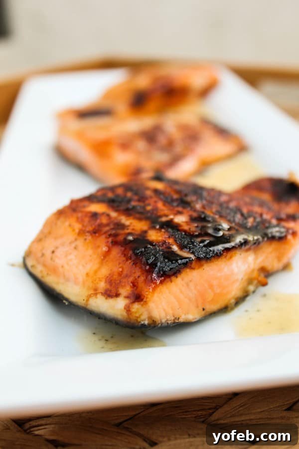 Honey-Glazed Salmon with Nutty Lime Butter Sauce 4 Plated honey salmon with sauce and fresh lime