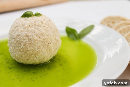 Goat Cheese Parmesan Crisps with Basil Infusion 3 Warm Parmesan Crusted Goat Cheese on a serving plate, drizzled with basil oil