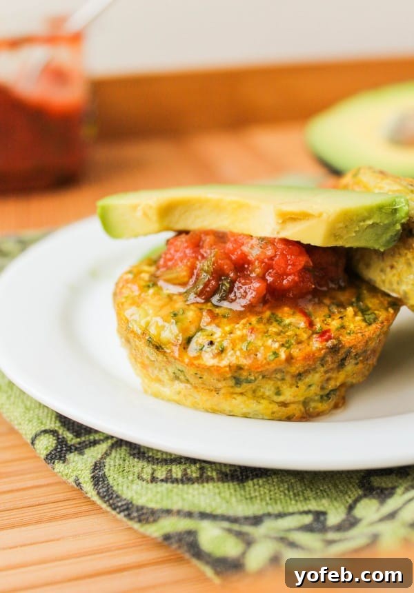 Garden Veggie Egg Bites 5 Several Baked Veggie Egg Cups on a plate with salsa and avocado