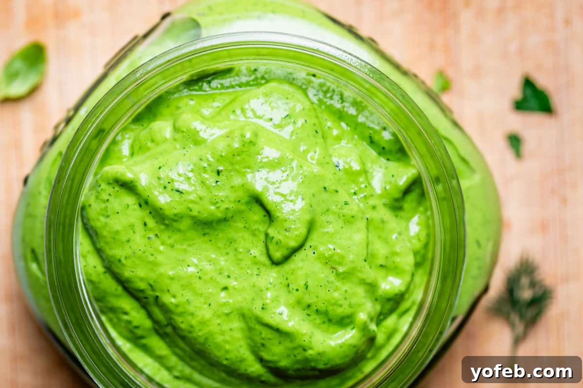 The Ultimate Green Goddess Salad 13 looking down at blended green goddess dressing in a glass mason jar.