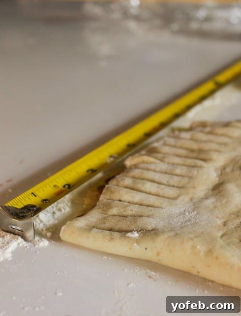 Cutting dough into strips with a pizza cutter