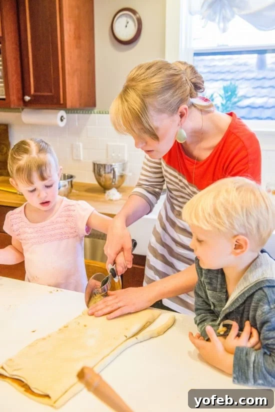 Swedish Cardamom Cinnamon Buns 4 Children in a kitchen, one holding a rolling pin