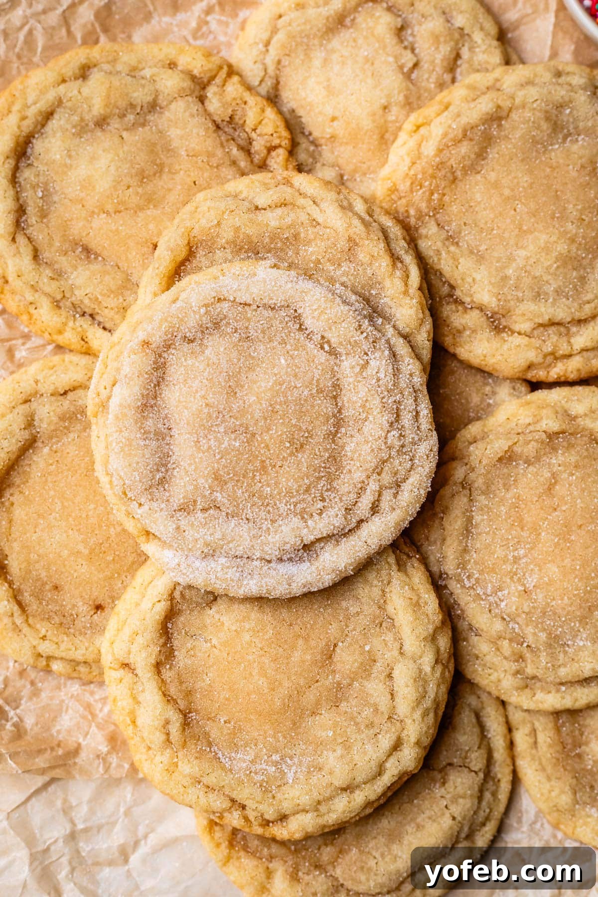No Roll Chewy Sugar Cookies 30 Minute Recipe 17 One heavily sugared drop cookie resting on a pile of about a dozen other cookies.