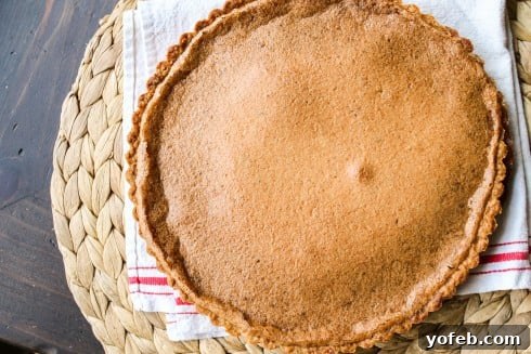 The golden-brown finished brown-butter cranberry tart, fresh from the oven.