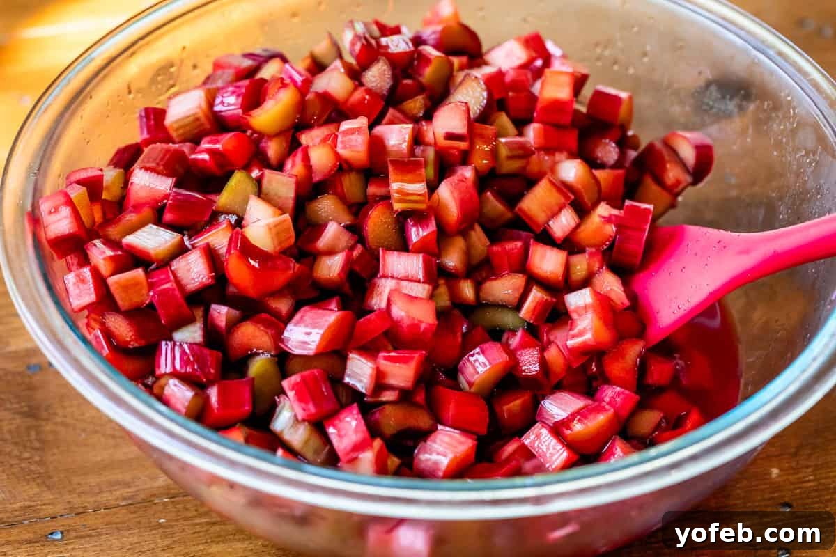 Summer's Sweet & Tart Strawberry Rhubarb Pie 13 chopped rhubarb soaking in grenadine in a glass bowl to get extra red coloring.