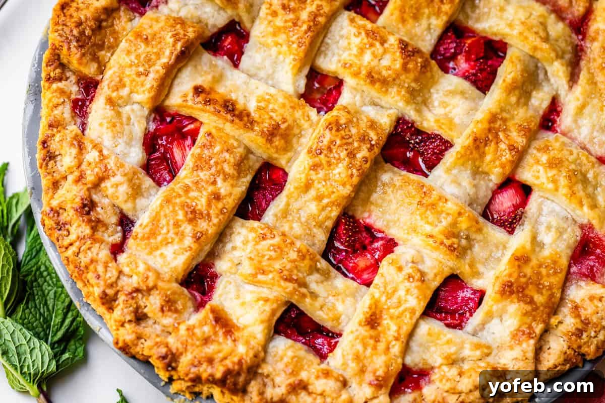 Summer's Sweet & Tart Strawberry Rhubarb Pie 25 a perfectly baked strawberry rhubarb pie with a perfectly cooked lattice crust.