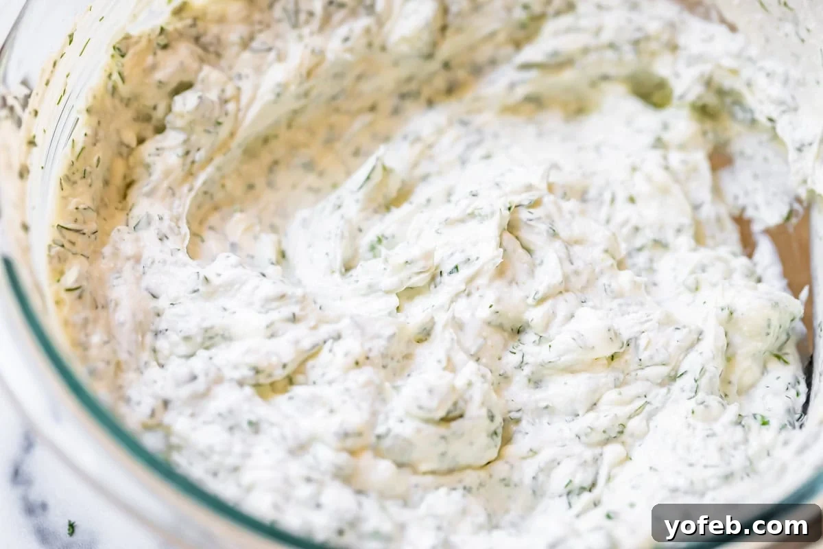 Vibrant Vegetable Stack 6 close up of creamy, herby cream cheese spread with dill and parsley in glass bowl.