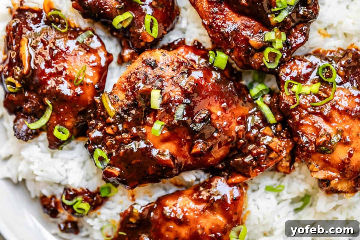 Easy Honey Garlic Chicken Slow Cooker Instant Pot 5 garlic honey chicken garnished with green onion served over white rice.